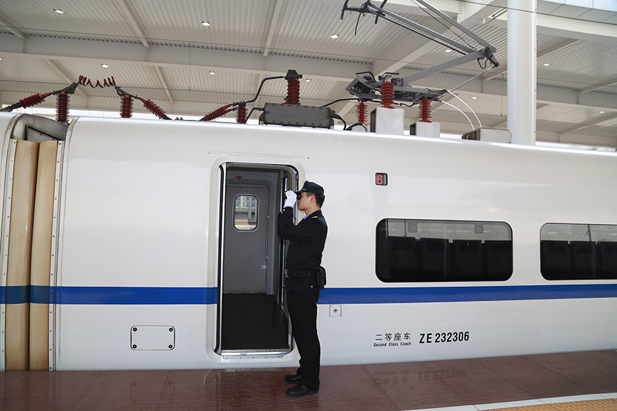 Attendants work in a standby bullet train