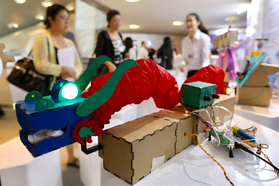 Participants try their hands on making robots at Summer Davos