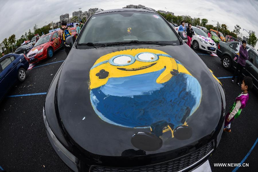 Cars with colorful cartoon drawings parade in Hangzhou