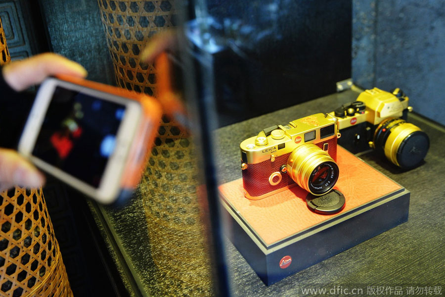 Gold plated leica cameras on display