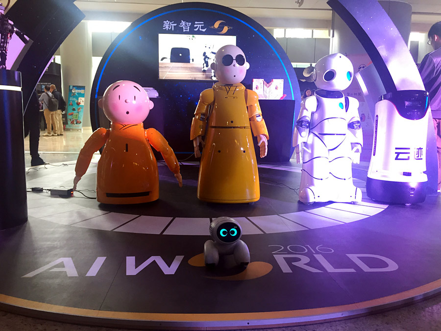 Intelligent robots interact with audiences at Beijing AI expo