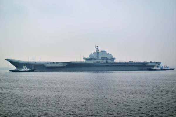 China's aircraft carrier anchors in military port