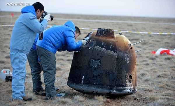 China's unmanned lunar orbiter returns home