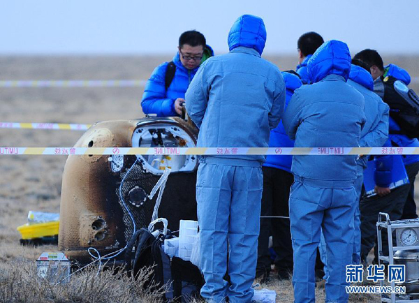 China's unmanned lunar orbiter returns home