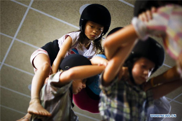 Chinese girl in local Spanish human tower team