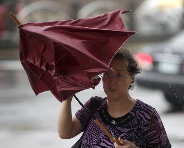 Typhoon Chan-Hom causes flooding, power cuts and panic buying