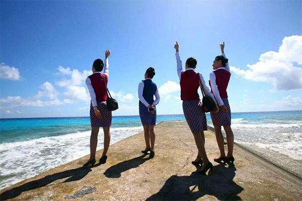 Chinese stewardess celebrate test flight at Nansha Islands airfield