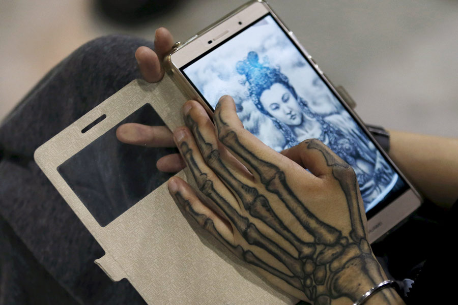 Tattoo fans, artists gather at Shanghai international art festival