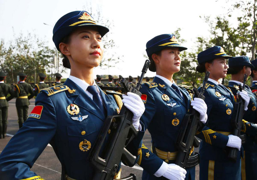 Marching with honor: Women soldier carrying the flag