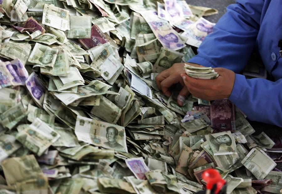 Cramped fingers, 24-hour security and sticky tape all part of a money counter's job