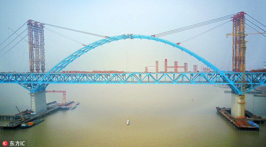 Arch of world's longest cable-stayed bridge joined