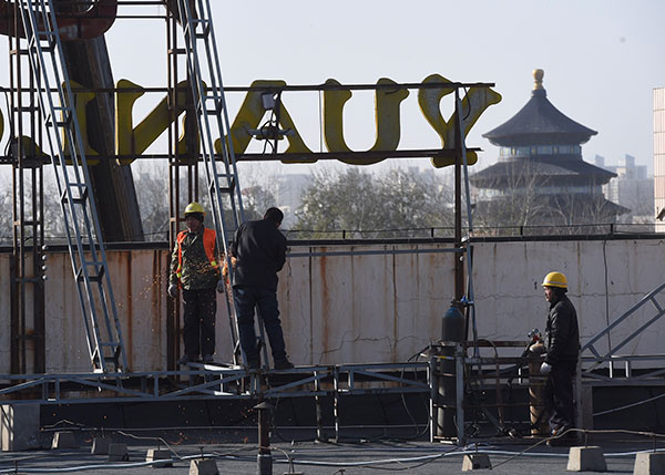 Beijing limits signs attached to top of buildings across city