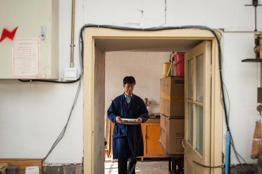 Clock repairman at Palace Museum keeps history in time