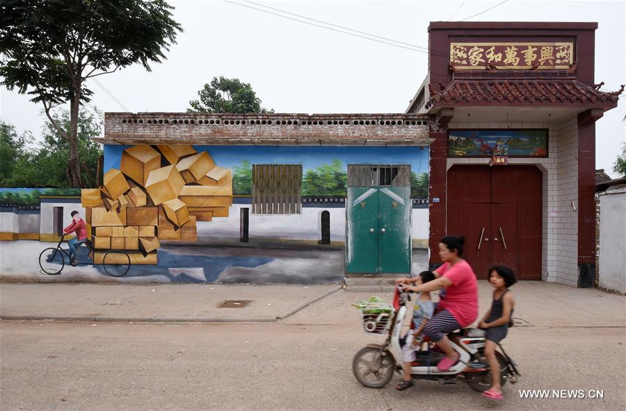 Qiannanbu village in N China covered with cultural graffiti works