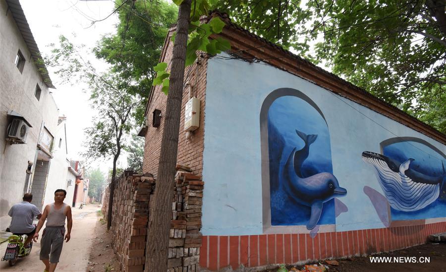 Qiannanbu village in N China covered with cultural graffiti works