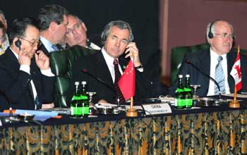 Chinese Premier Wen Jiabao (L) sits with Australian Prime Minister John Howard (R) and Canadian Foreign Minister Pierre Pettigrew (C) during the opening of the Special Asean Leaders' Meeting on Aftermath Quake and Tsunami Summit at the Jakarta Convention Centre January 6, 2005. Global leaders gathering in Jakarta to discuss the tsunami that devastated countries around the Indian Ocean will try to draw lessons from the disaster, including looking at a future warning system. [Reuters]