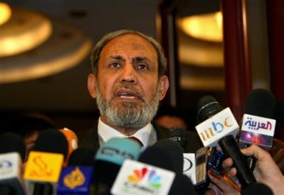 Hamas leader Mahmoud Zahar listens to a question during an impromptu news conference, held shortly after Zahar met with Palestinian Authority (news - web sites) President Mahmoud Abbas, also known as Abu Mazen, in Gaza City, Gaza Strip (news - web sites), Saturday, Feb. 12, 2005. Abbas is in Gaza over the weekend to meet with leaders of militant factions, to push them to honor a days-old cease-fire marred by mortar and rocket attacks on Israeli targets, according to an aide. (AP Photo/Brennan Linsley) 