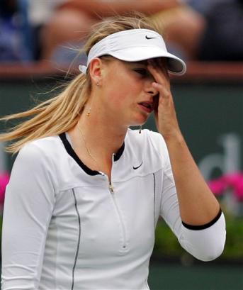 Maria Sharapova of Russia reacts in the closing minutes of her match against Lindsay Davenport during the semifinals of the Pacific Life Open, Friday, March 18, 2005, in Indian Wells, Calif. Davenport won the match 6-0, 6-0. [AP]