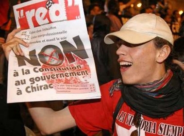 'No' vote supporters celebrate after France voted against the ratification of the European constitution in Paris' Place de la Bastille May 29, 2005. France overwhelmingly rejected the European Union's constitution in a referendum on Sunday, plunging the EU into crisis and dealing a potentially fatal blow to a charter designed to make the enlarged bloc run smoothly. REUTERS