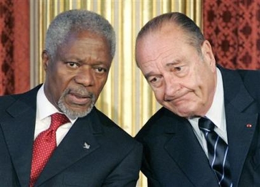 French President Jacques Chirac, right, listens to United Nations Secretary General Kofi Annan during a conference devoted to the so-called Global Compact, a voluntary charter of rules of ethics for businesses, Tuesday June 14, 2005 in Paris. (AP