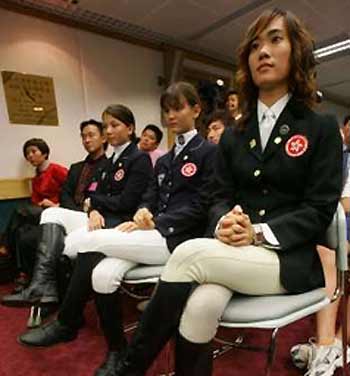 Members of the Hong Kong equestrian team (R-L) Karen Mak, Gaelle Tong and Magali Tong attend a news conference announcing the equestrian events at the 2008 Beijing Olympics to be staged in Hong Kong July 8, 2005. 