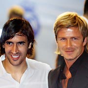 Real Madrid's players Raul (L) and David Beckham pose for photographers after arriving at Real MadridKs Santiago Bernabeu stadium for the premiere of Real Madrid's film "Real: The Movie" in Madrid August 25, 2005.