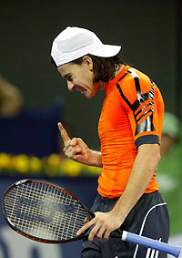 uillermo Coria of Argentina reacts after he missed a shot during his match against David Nalbandian of Argentina at the Tennis Masters Cup in Shanghai, China November 15, 2005. Nalbandian defeated Coria 7-5 6-4.