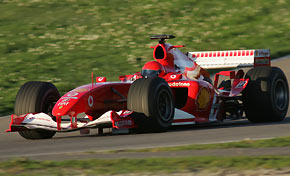 YMoto GP World Champion Valentino Rossi drives a 2005 model Ferrari Formula One car on Mugello racetrack November 10, 2005. Rossi has tested twice before for Ferrari, in April 2004 and more seriously in August this year, and the former champions have expressed an interest in luring him to Formula One when he tires of MotoGP.