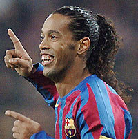 Barcelona's Ronaldinho celebrates after scoring the second goal against Real Madrid during their Spanish League football match at Santiago Bernabeu stadium in Madrid. 