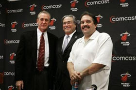 Former coach Pat Riley, left, team owner Micky Arison and Stan Van Gundy pose for photos after the Monday, Dec. 12, 2005 press conference in Miami, where Van Gundy explained why he was resigning as head coach and Pat Riley announced he was taking charge of the team. 