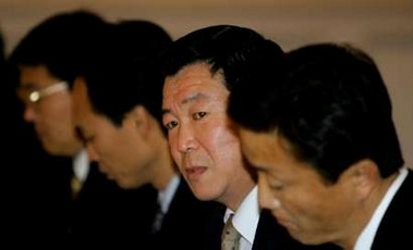 North Korean negotiator Kim Zhe-hu (C) meets a Japanese delegation in Beijing, China February 5, 2006. 