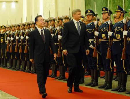 President Hu meets Canadian PM to cement ties