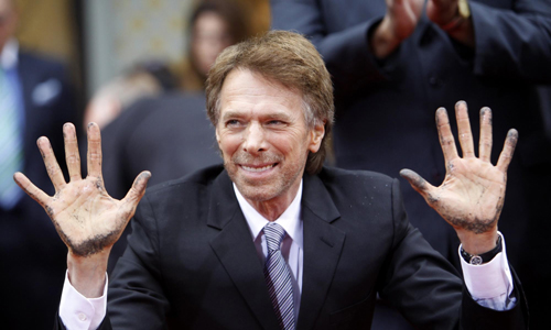 Actors Nicolas Cage and Tom Cruise attend hand and footprints ceremony for producer Jerry Bruckheimer