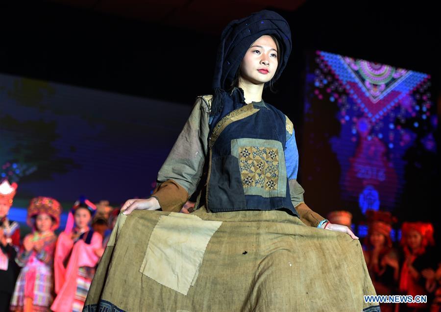 Models present costumes of ethnic groups in Yunnan