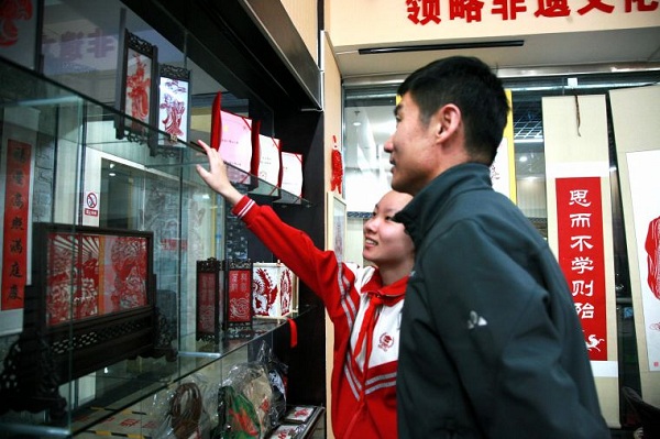 Young pupils learn paper cutting