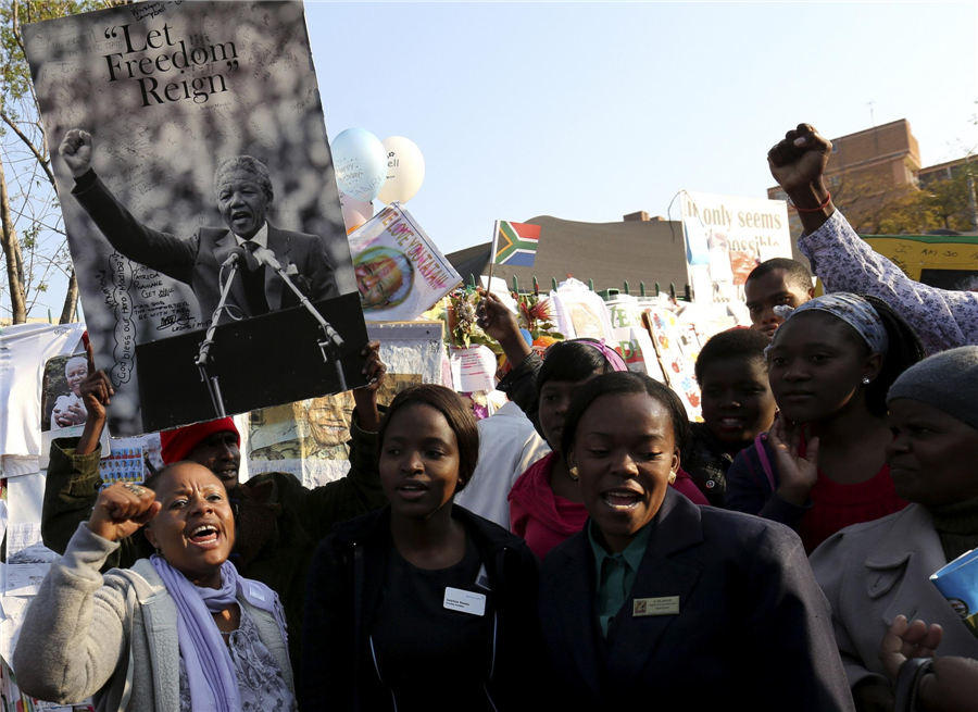 'Improving' Mandela marks 95th birthday