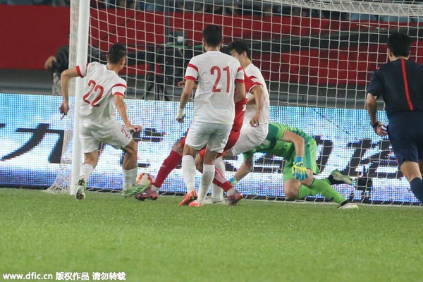 Last goal helps China tie Tunisia at Friendly