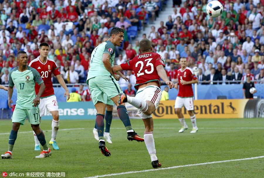 Ronaldo scores twice to help Portugal reach round of 16