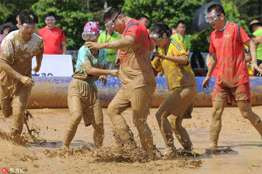 Swamp soccer: Players battle for ball in Nanjing