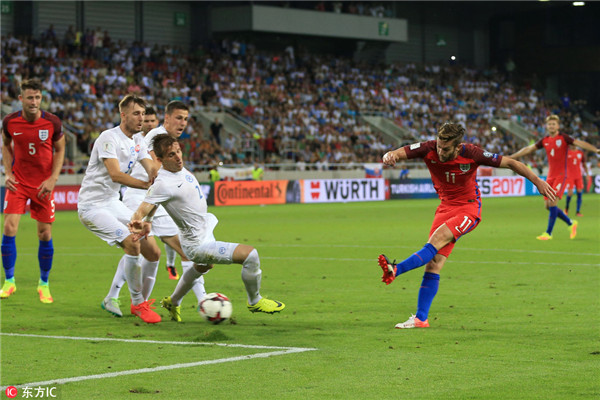 England claims last-minute win in World Cup qualifier