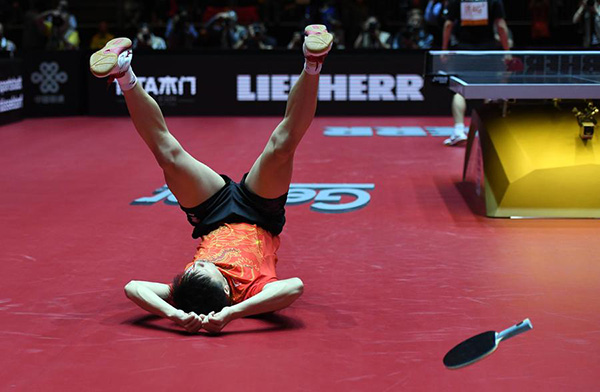 Ma Long retains men's title in thrilling final