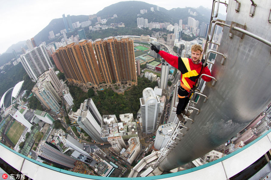 Daredevil thrill-seekers on top of Hong Kong