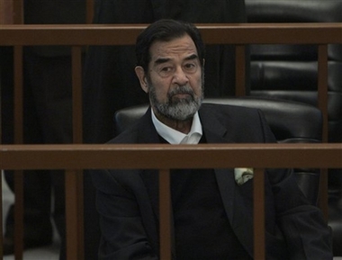 Saddam Hussein, in court Monday Dec. 4, 2006 during his trial with other defendants in Baghdad, Iraq, for genocide in the 'Anfal' offensive against the Kurds. Saddam and six co-defendants, face possible execution if convicted for the 1987-88 military offensive against the Kurds of northern Iraq. The prosecution estimates that 180,000 Kurds were killed in the campaign, code-named Operation Anfal, in which Saddam's army allegedly destroyed hundreds of villages and killed or scattered their inhabitants. (AP 