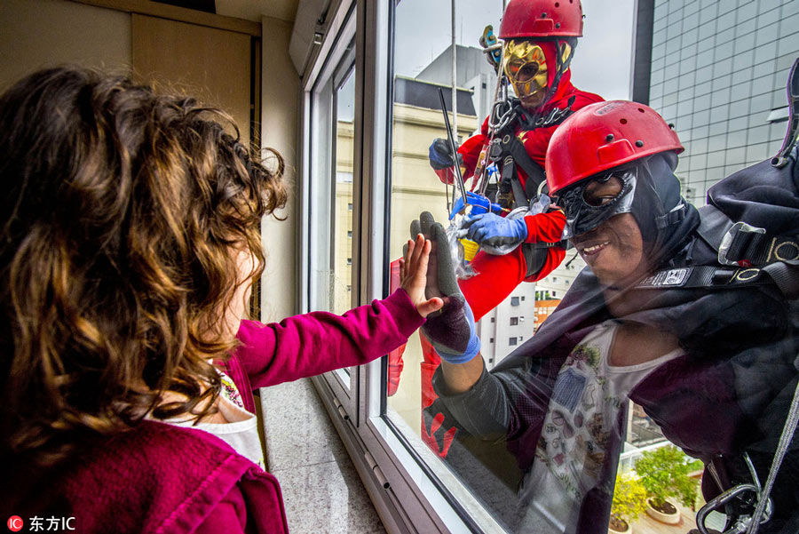 Superheroes cheer up sick children in Sao Paulo