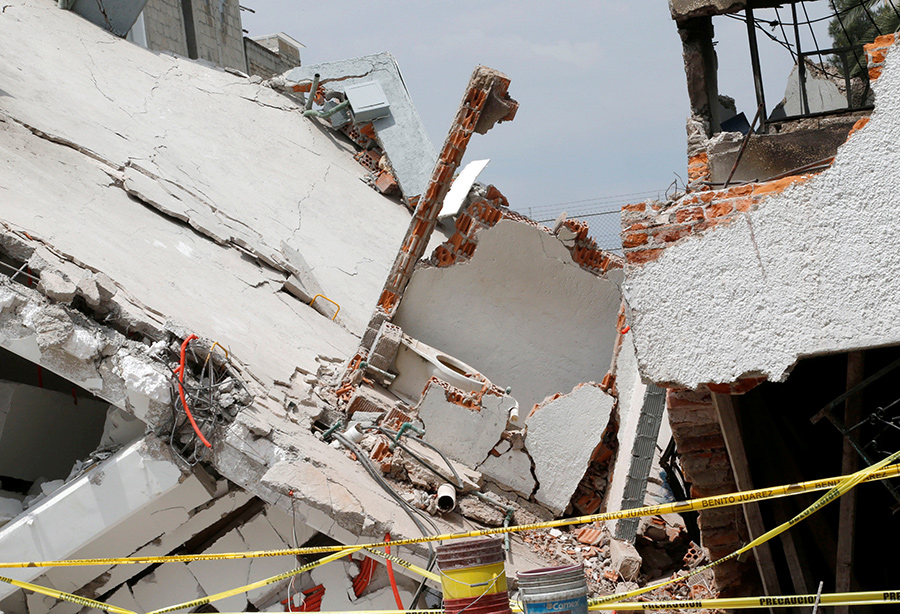 Mexicans dig through collapsed buildings as quake kills 225