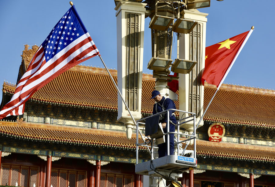 National flags of China and US fly along Chang'an Avenue before Xi-Trump meeting